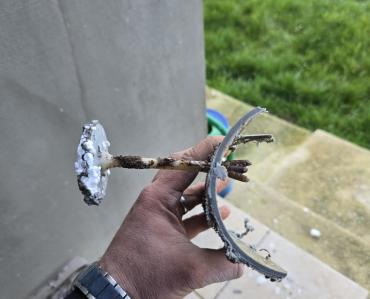 Facade workers drilled through the vertical sewage pipe